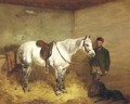 A saddled grey pony and groom in a stable with a retriever - Harry Hall