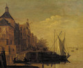 A town by a river with sailing vessels moored at a quay, at dusk - (after) Jacob Adriaensz. Bellevois