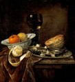 Still Life Of An Orange And A Lemon In A Porcelain Bowl, A Roemer, A Melon, A Sliced Herring On A Pewter Plate, And A Peeled Lemon Together On A Table Draped With A Velvet Cloth - Abraham Hendrickz Van Beyeren